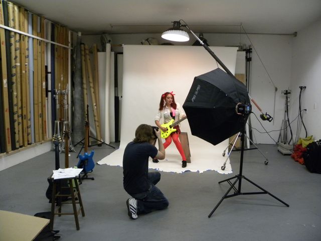 Gelvin Guitars ad shoot with a neon one-piece electric guitar