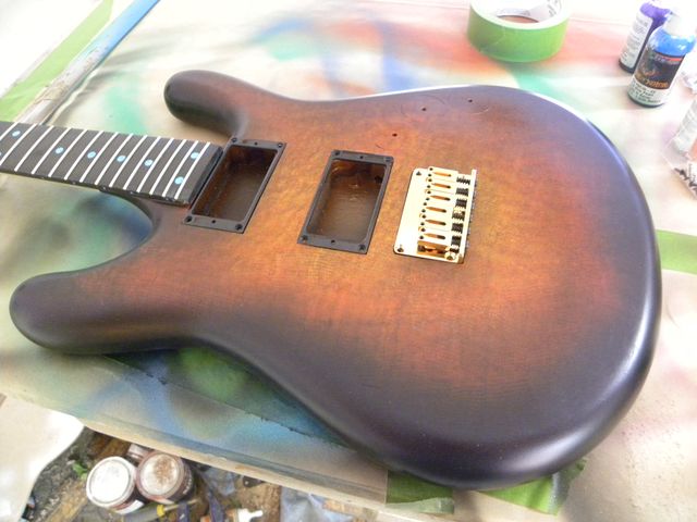 Gelvin electric guitar body with a hand-sprayed sunburst finish in progress