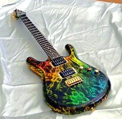 Gelvin OPS one-piece korina electric guitar with a rainbow burst finish