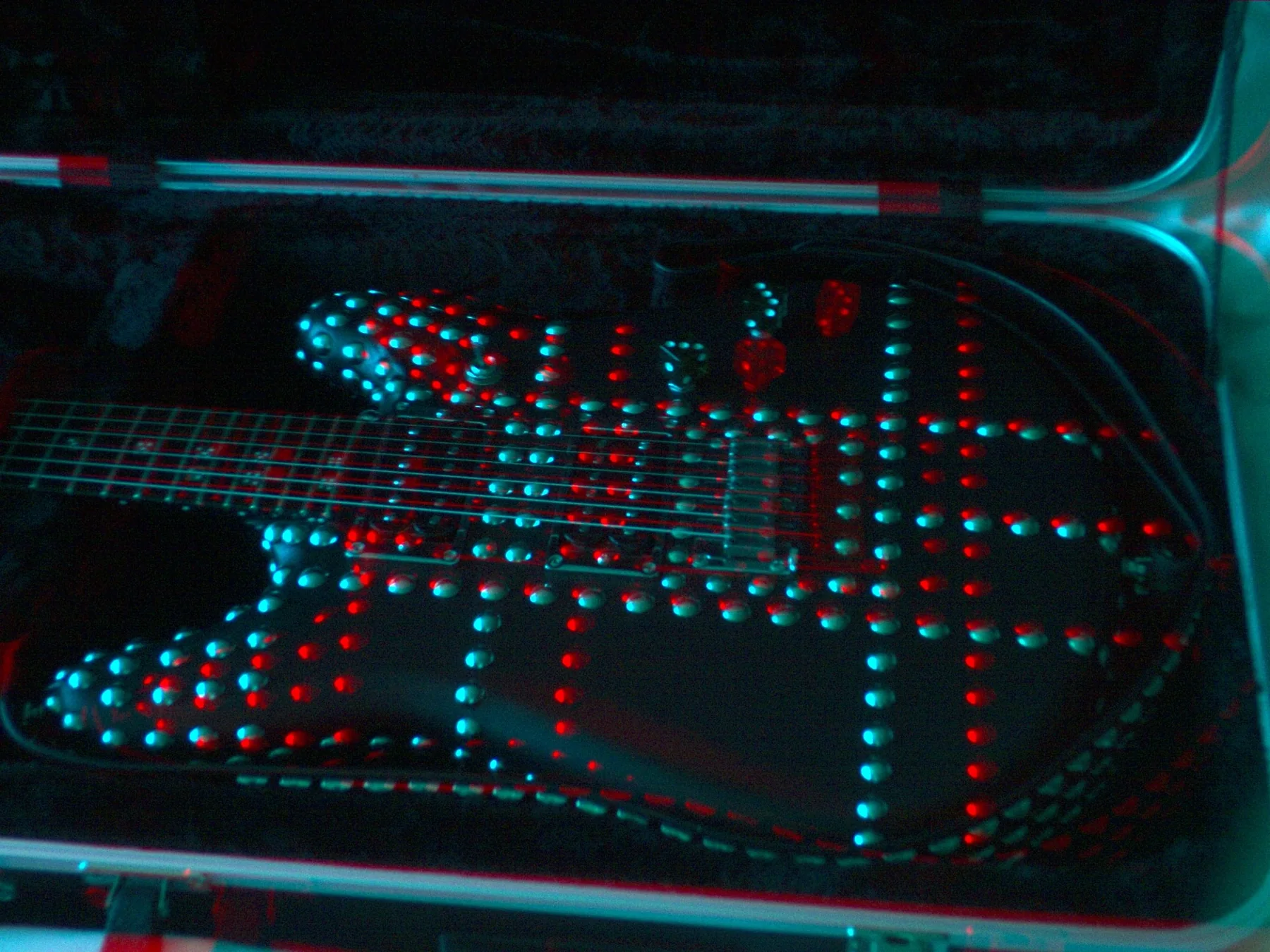 Red and cyan 3D detail of the leather, studs and controls