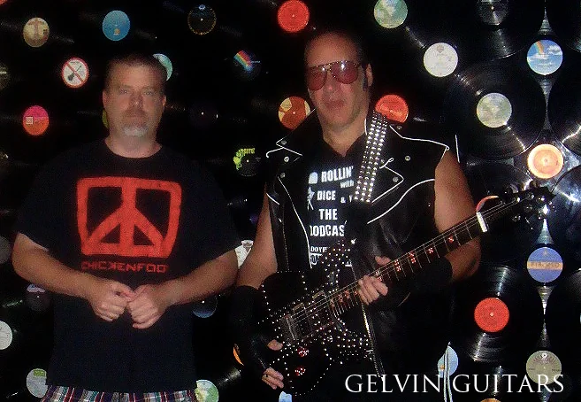 Will Gelvin and Andrew Dice Clay with the custom black leather Gelvin OPS guitar
