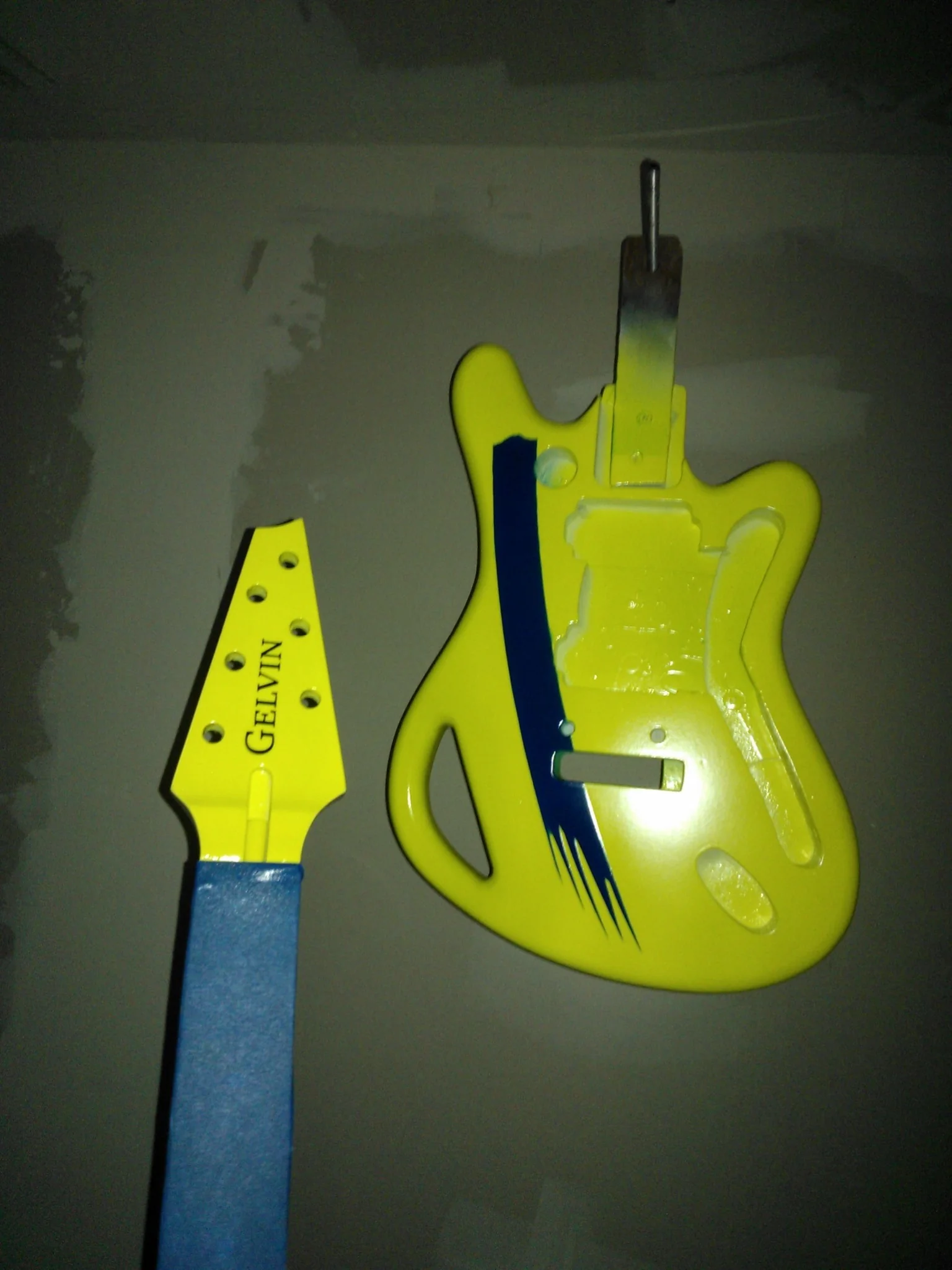 Neon yellow Dale Bozzio SSM body and headstock during painting