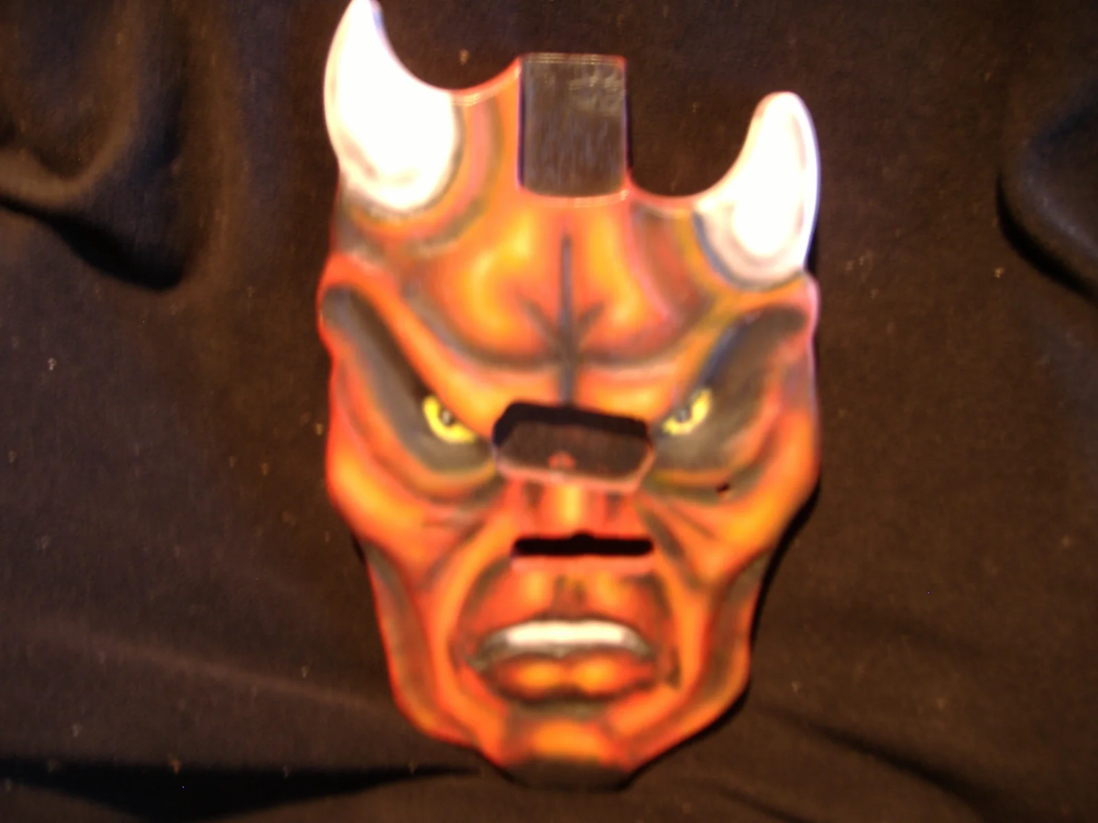 Early carved red demon guitar body made from scrap wood before Gelvin Guitars