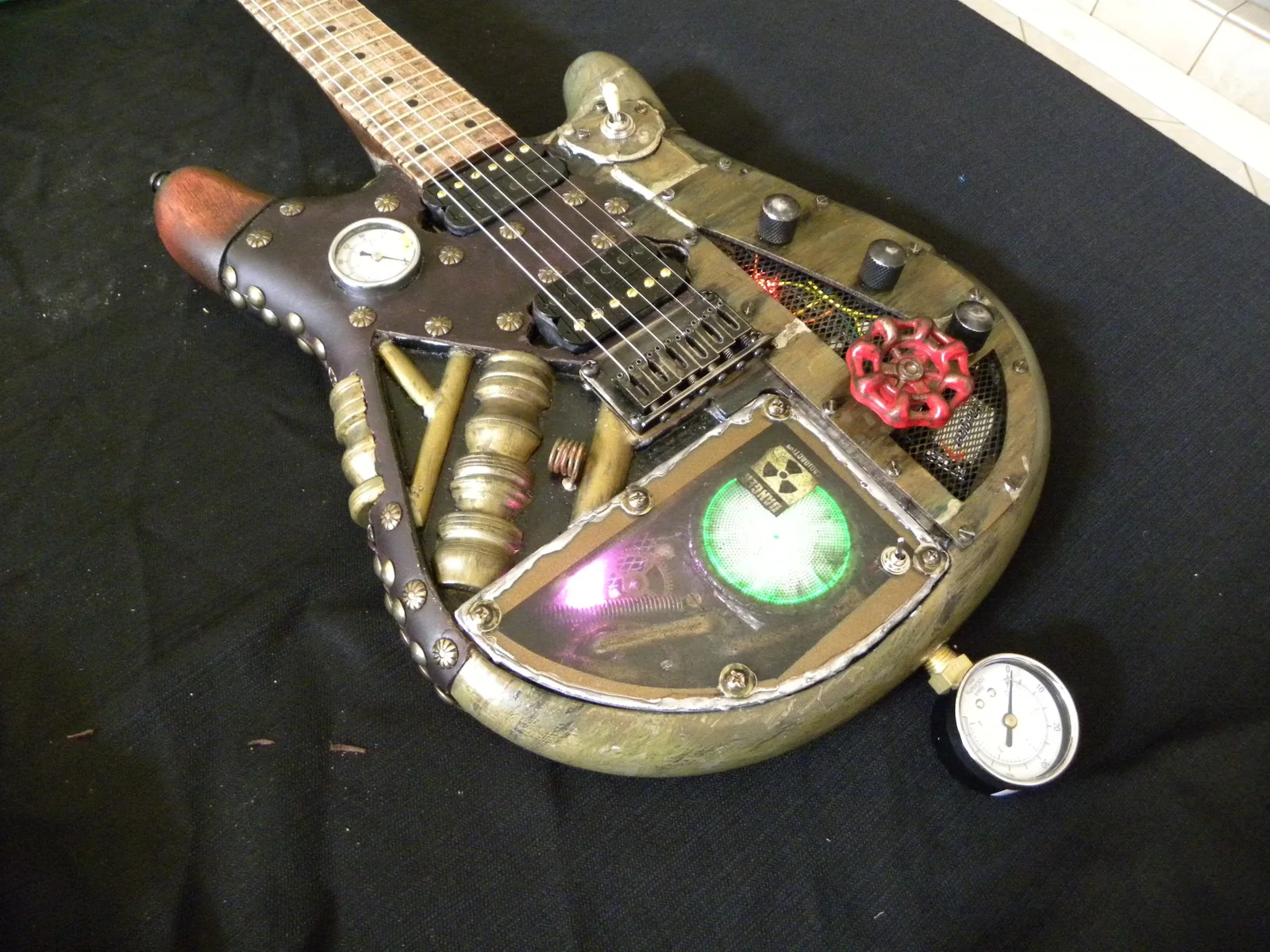 Three-quarter close view of the finished steampunk guitar