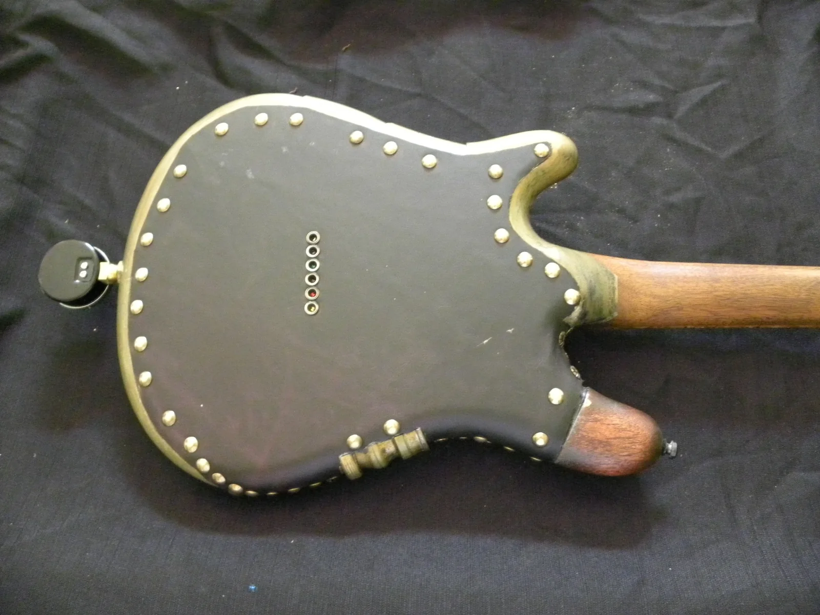 Leather-covered back of Rayko Dig steampunk guitar